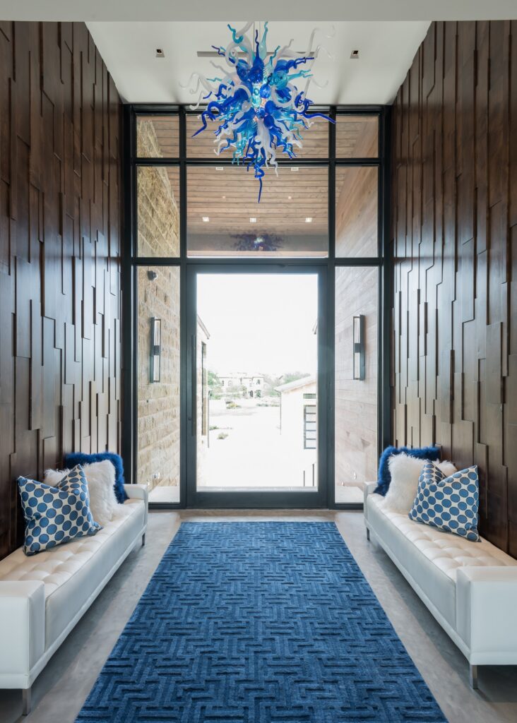 entry foyer with accent wall and large windows