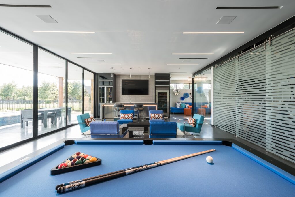Entertainment room with bar and billiards table