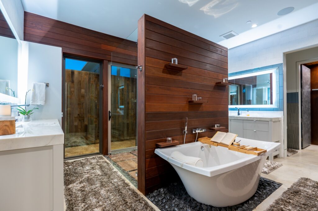 Large bathroom with stand alone tub and large glass shower stall