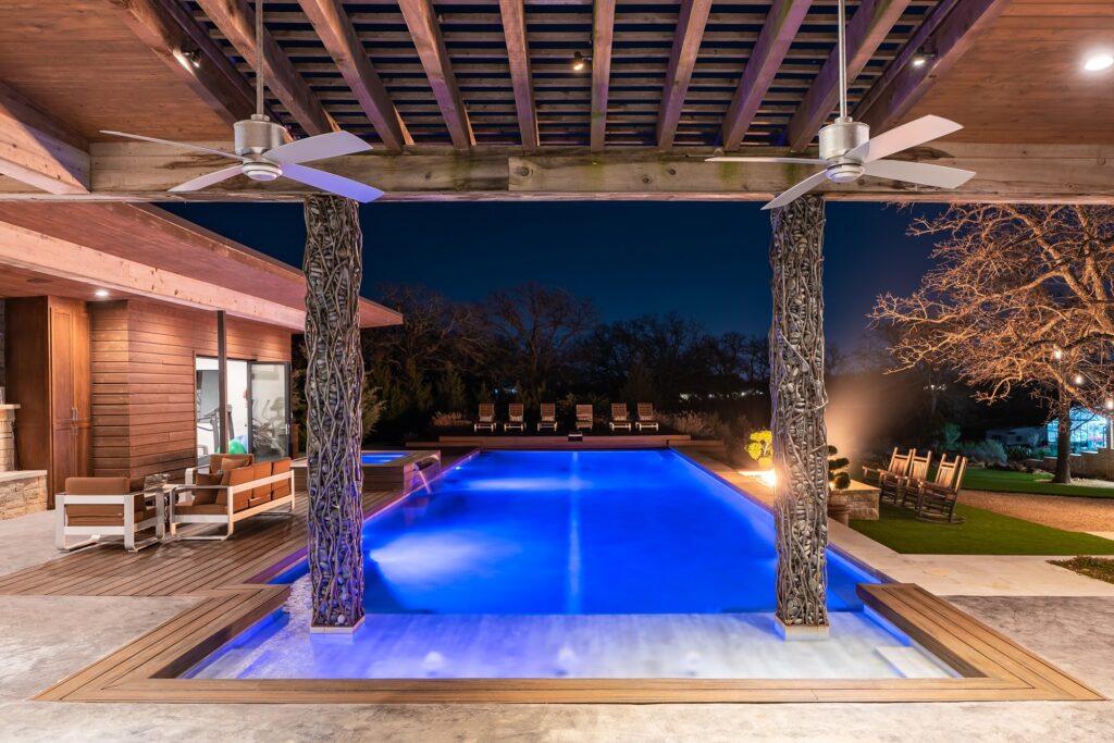 Pool deck with fire pit and covered patio