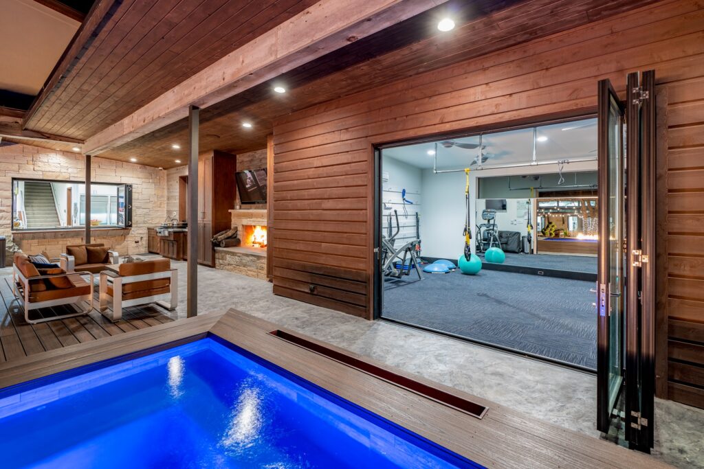 Pool deck with covered patio and gym