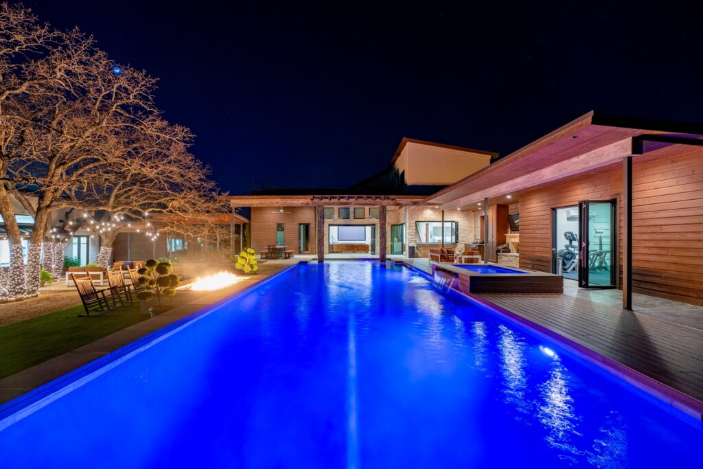 Pool deck with fire pit and covered patio