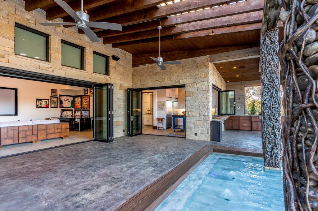 Pool deck with fire pit and covered patio