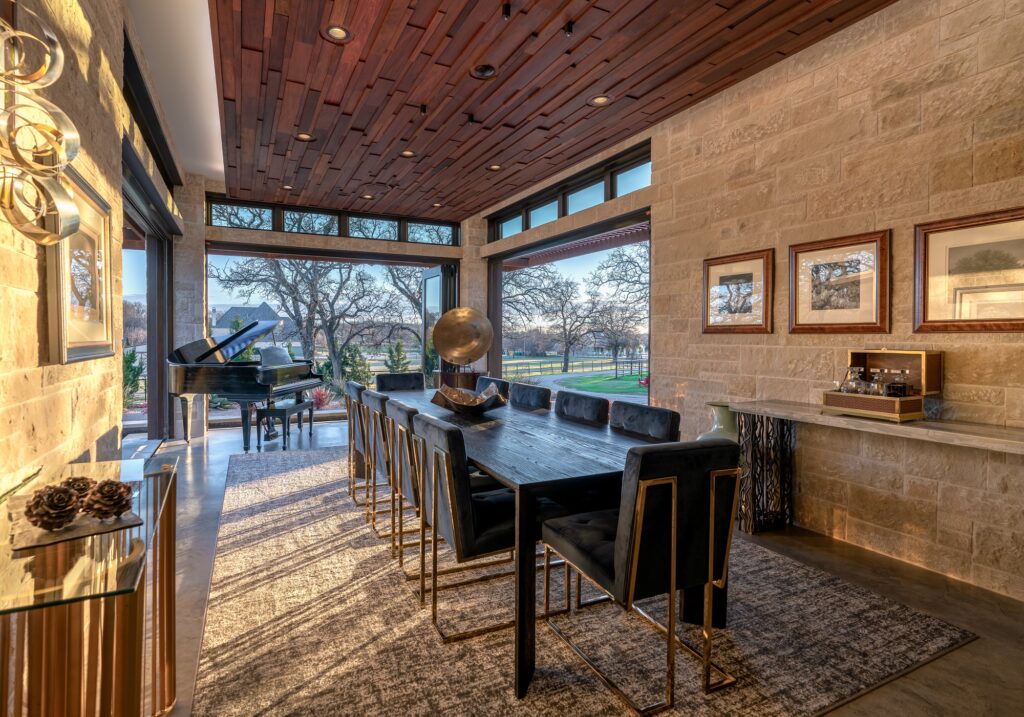 Open air dining room with glass doors on three sides